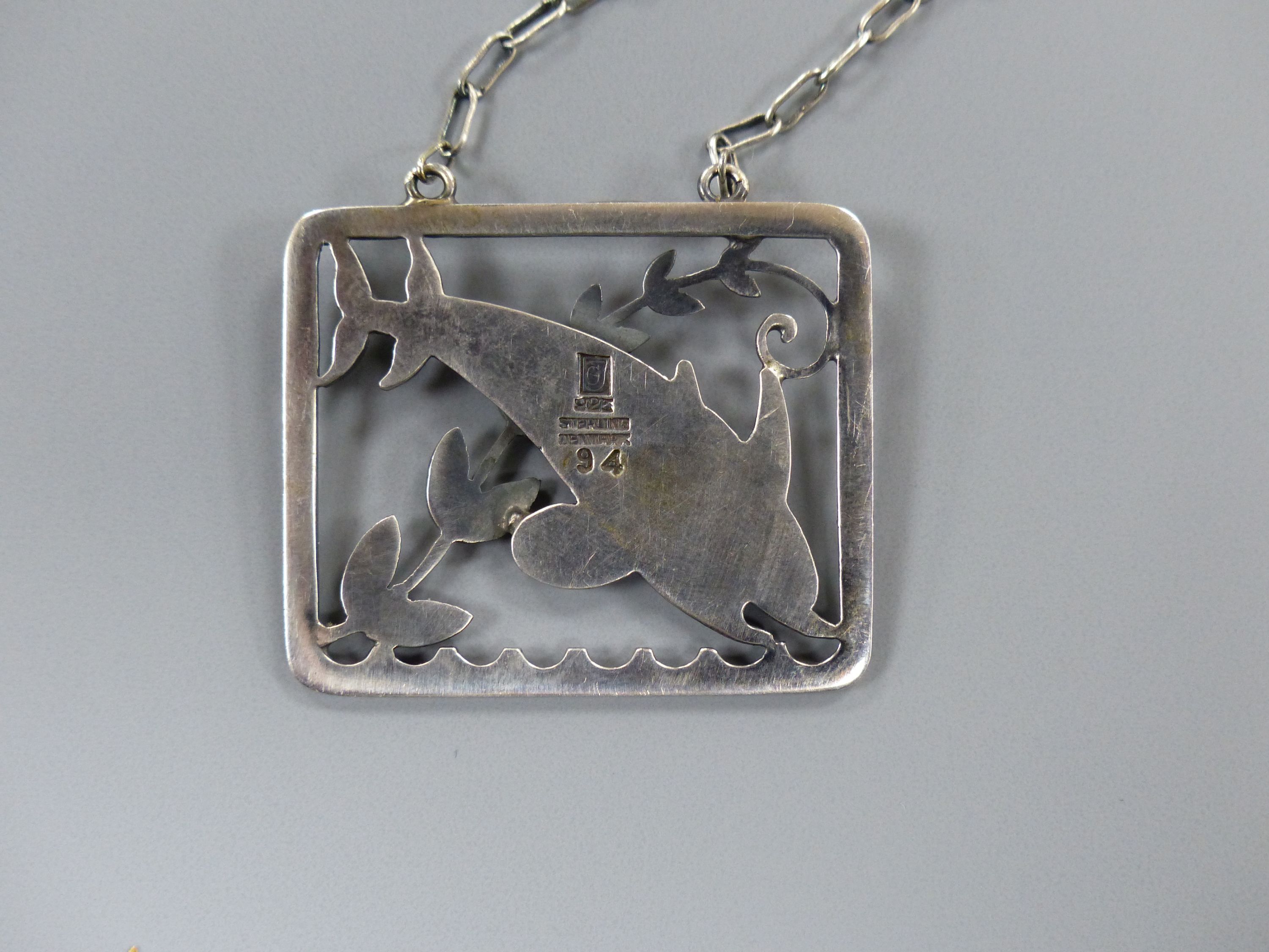 A Georg Jensen sterling twin leaping dolphin with frond rectangular pendant necklace, no. 94, pendant, 36mm, chain, 58cm.